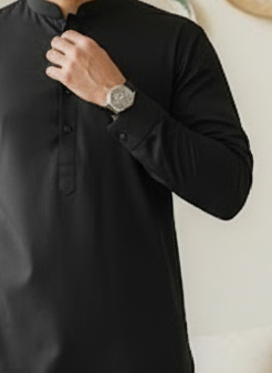 Man in a black kurta shalwar 