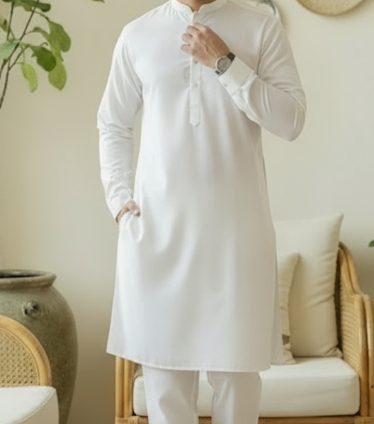 Man in a white wash n wear kurta shalwar 